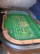 8' dice table, new layout, like new condition. Has bank cover, drop box, mirrow. www.usedcasinoequipment.com 
